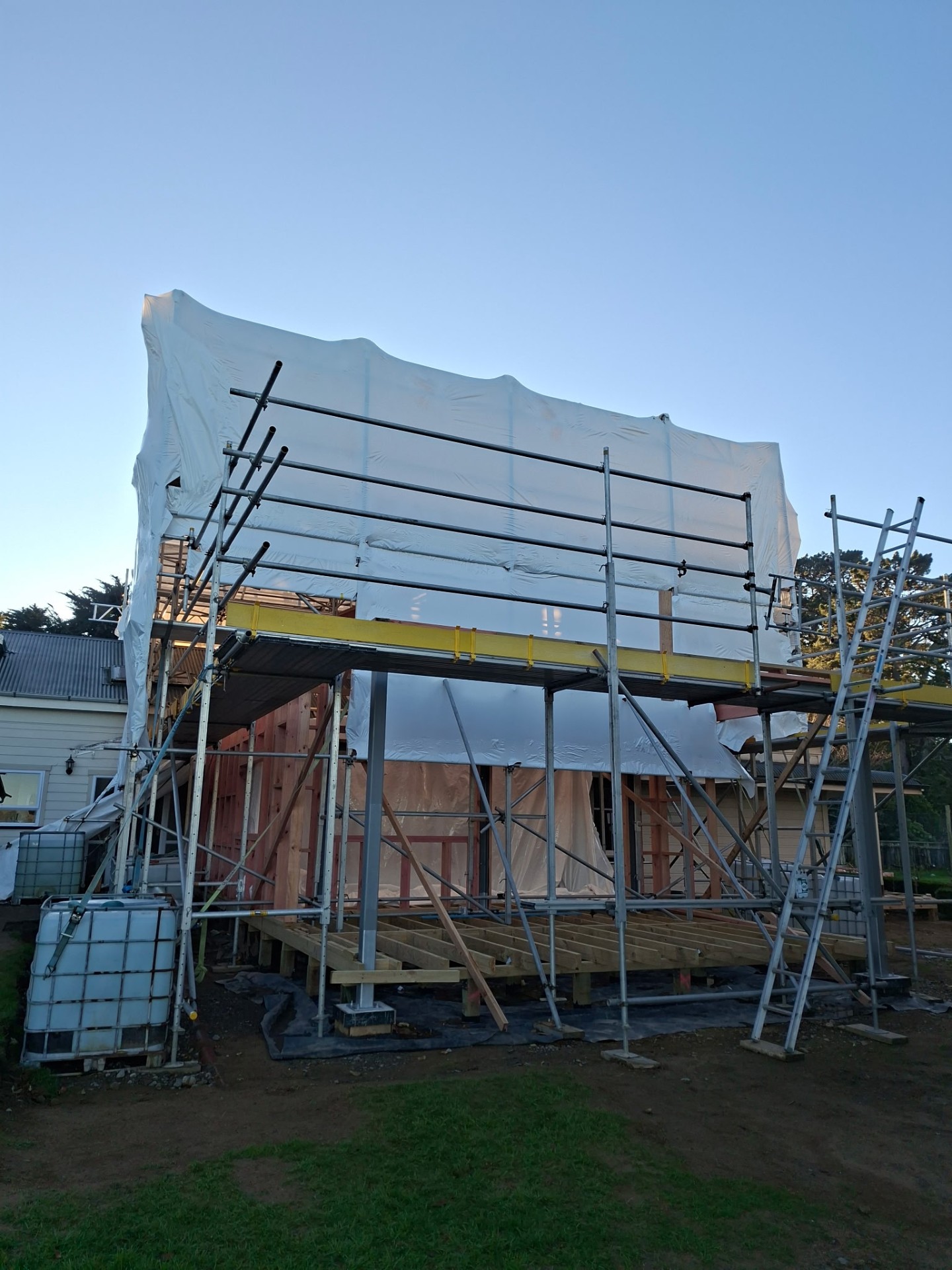 Shrink-Wrapped Weather Protection — New Build